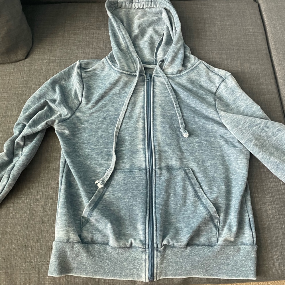 blue zip-up sweater